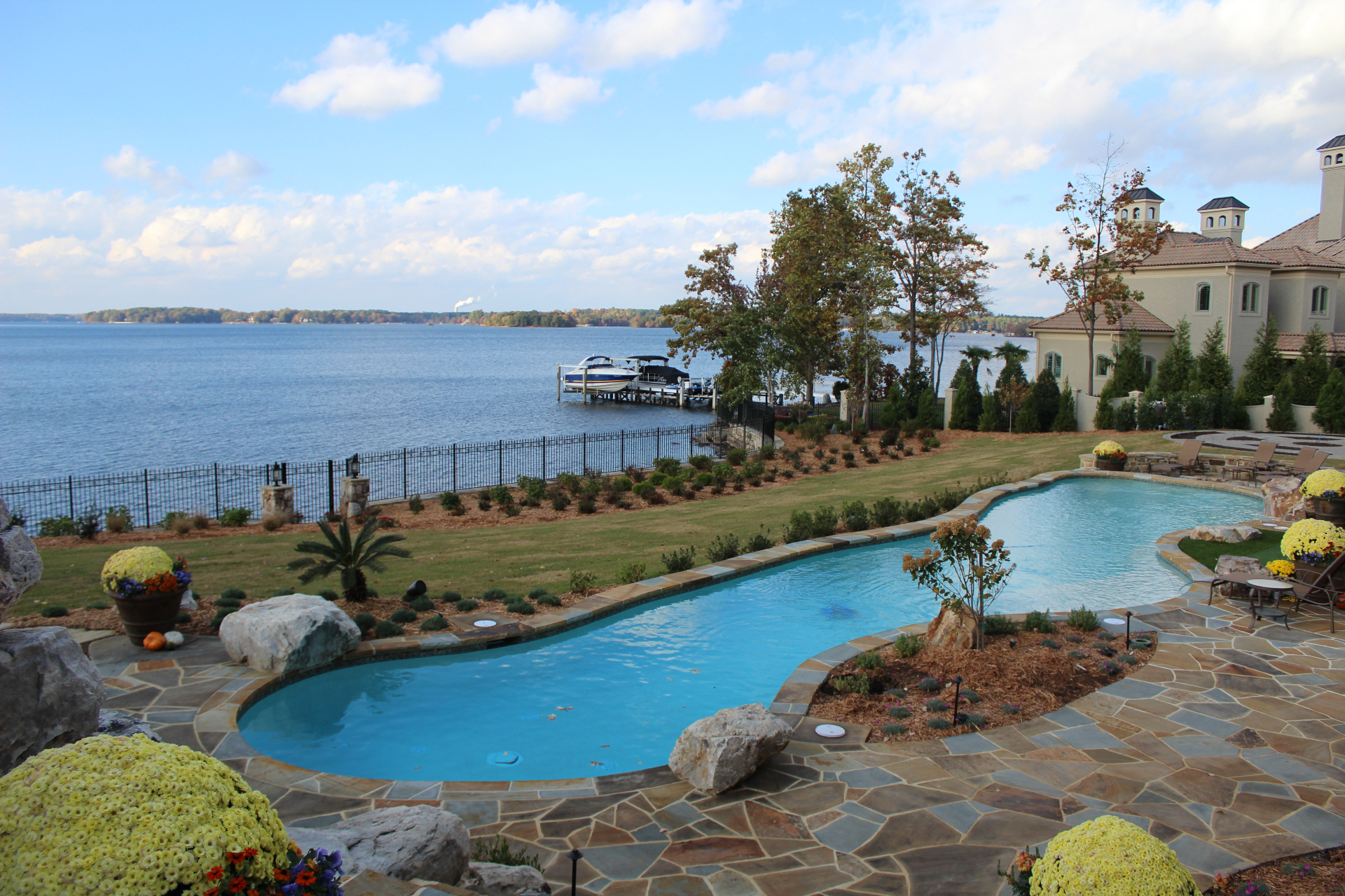 Poolside ornamental fence with lake view