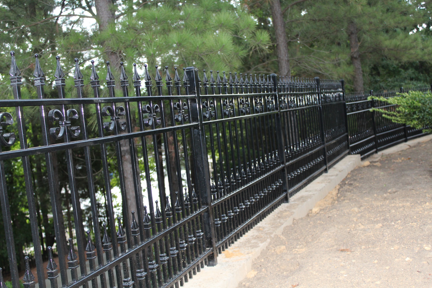 Ornamental black wrought iron fence installed by Charlotte Fence Builders